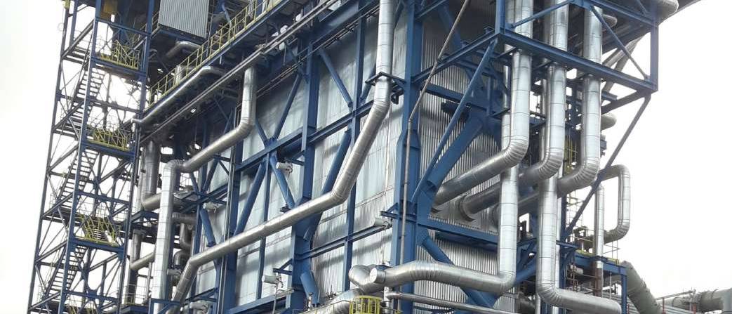 Industrial steel structure with insulated piping at Aboadze Thermal Power Plant
